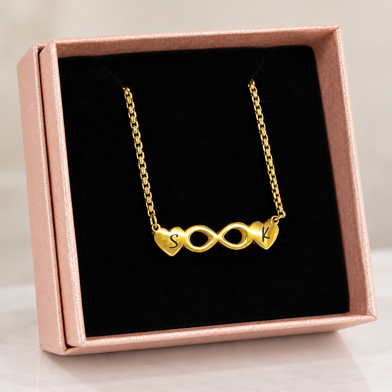 Personalized Infinity Heart Necklace – 18K Gold Plated 3 Personalized gold infinity heart necklace displayed in a rose-gold gift box